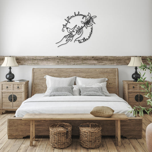 Black Metal line art of 2 hands, one holding a branch with leaves and berries and one with a bird sitting on it with quote in it's beak and flowing around all 3  "the future belongs to the curious" shown on wall over bed